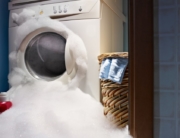 Washing machine overflowing with suds