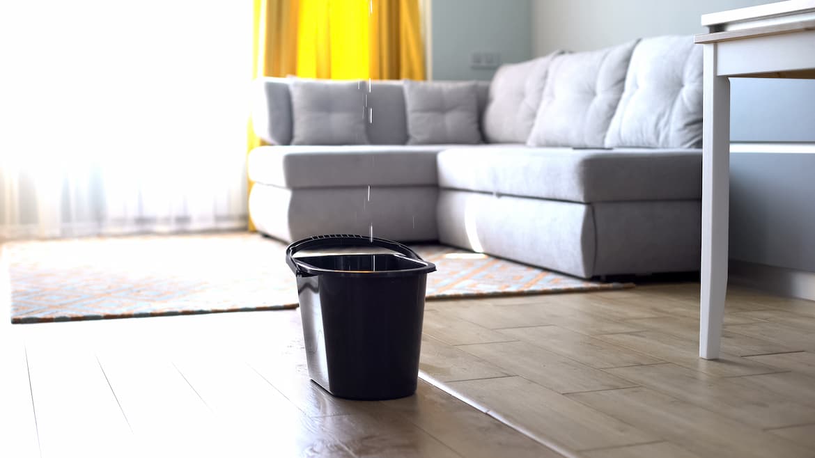 A basket placed in a room with the roof leaked